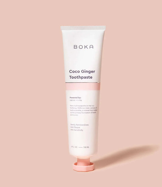 A photo of Boka Coco Ginger clean, toxic free toothpaste against pink background.
